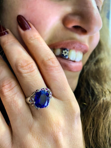 Blue Mystery Stone and White Gold Claw Ruby Accented Ring