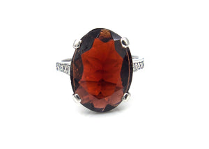 Oval Faceted Garnet and Diamond Ring