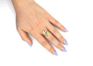 Light Blue Topaz Twist Ring in 14K Gold