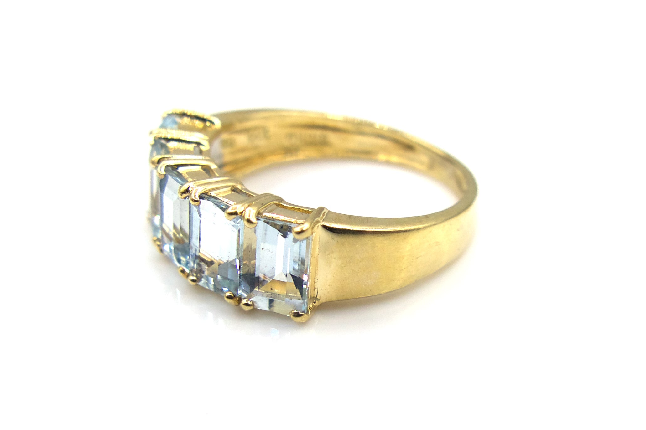 Light Blue Emerald Cut Topaz Row Ring in 14K Gold