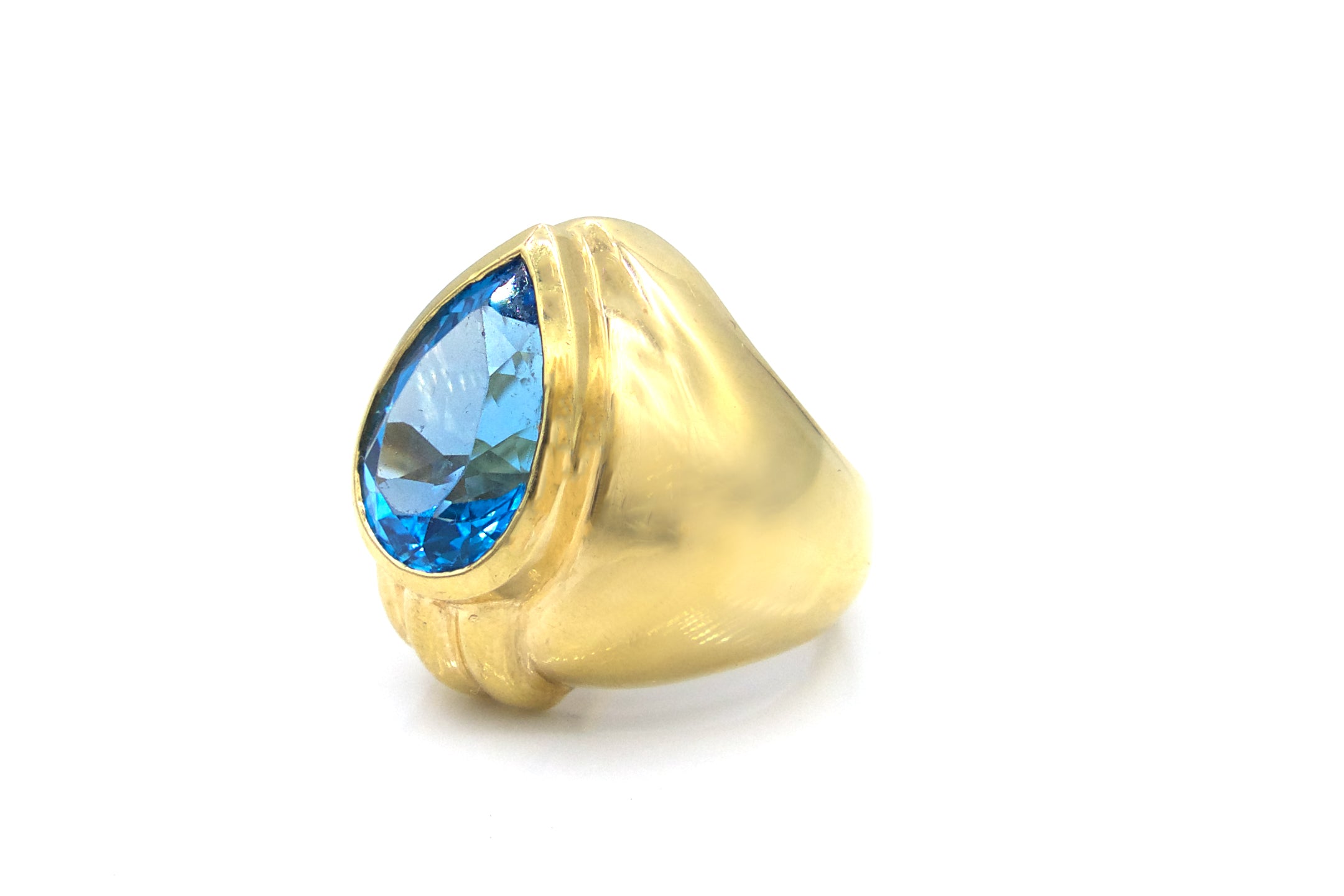 Pear Shaped Bright Blue Bezel Set Topaz Cocktail Ring in 14K Gold