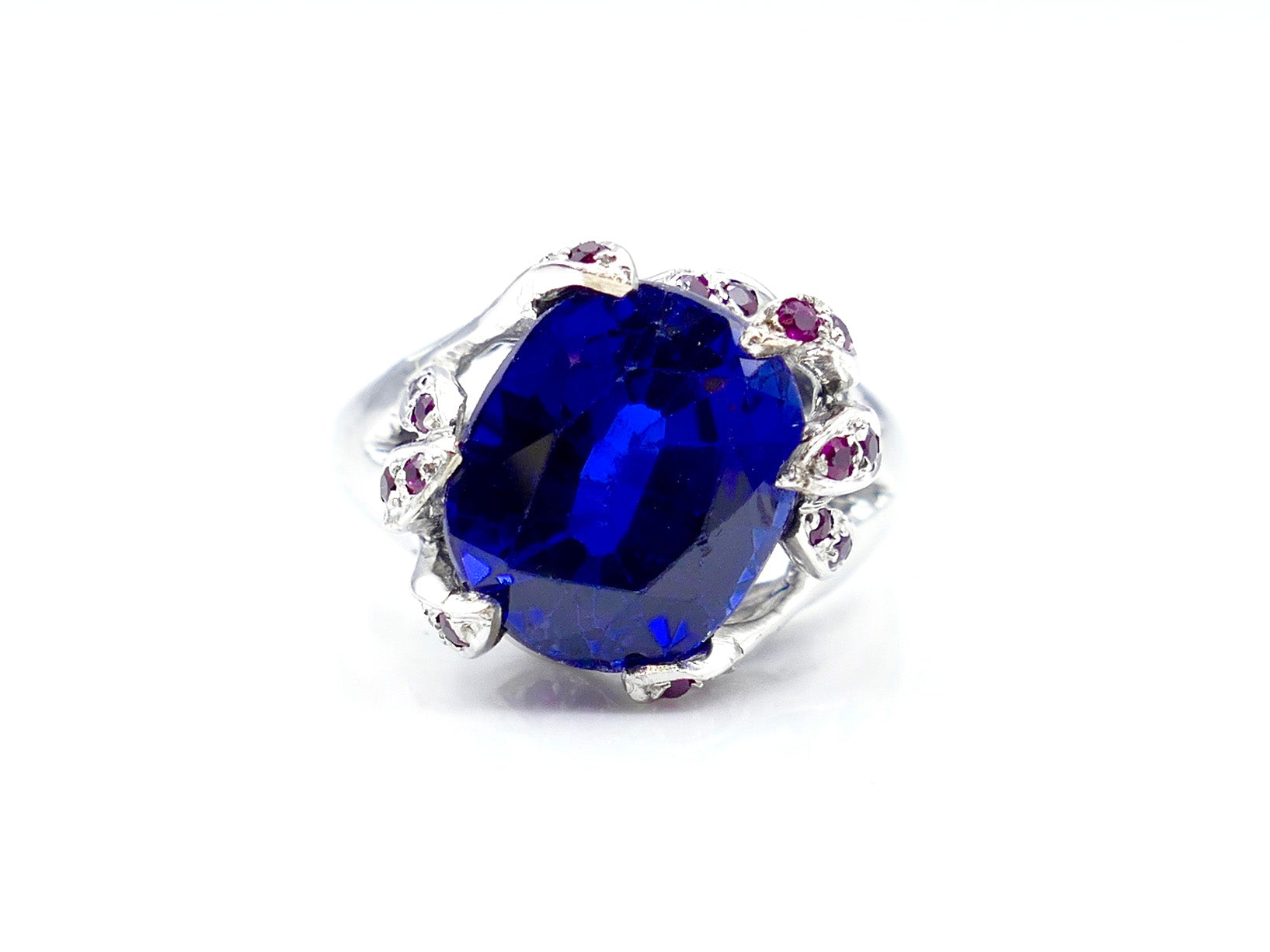Blue Mystery Stone and White Gold Claw Ruby Accented Ring