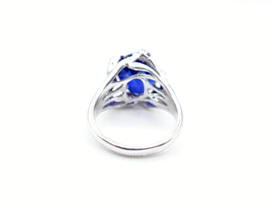 Blue Mystery Stone and White Gold Claw Ruby Accented Ring